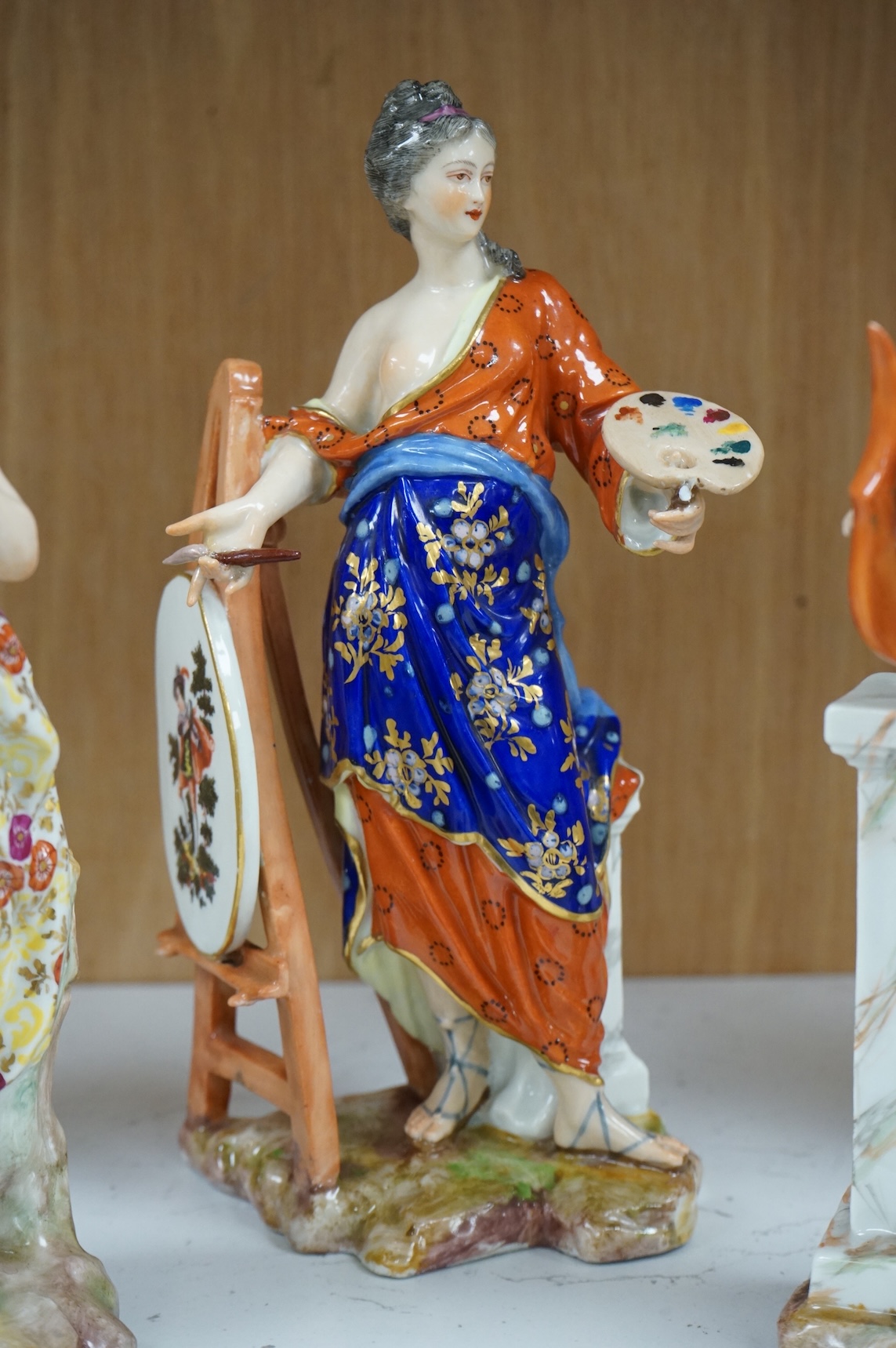 A set of four French Derby style porcelain figures, emblematic of art, sculpture, music and theatre, tallest art 22.5cm high